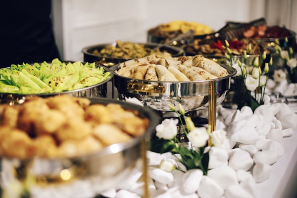 Catering spread with variety of dishes prepared by Henza Events team