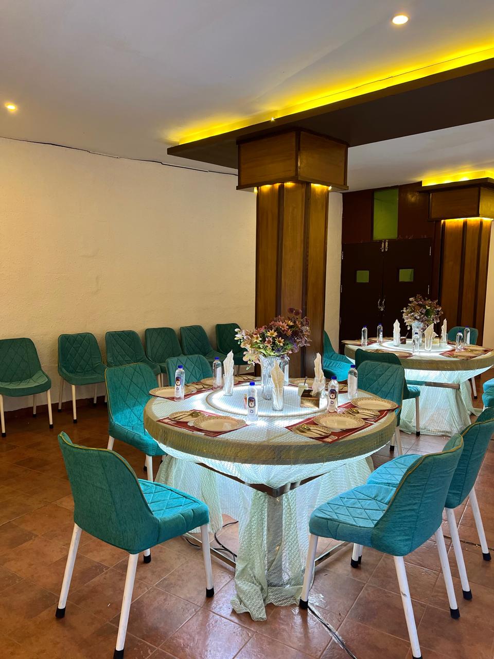 Professional catering team setting up banquet tables